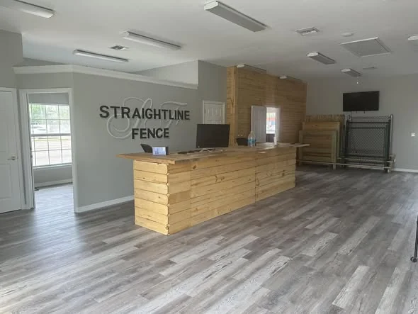 Front desk and product samples inside the Straightline Fence showroom in St. Cloud, Florida