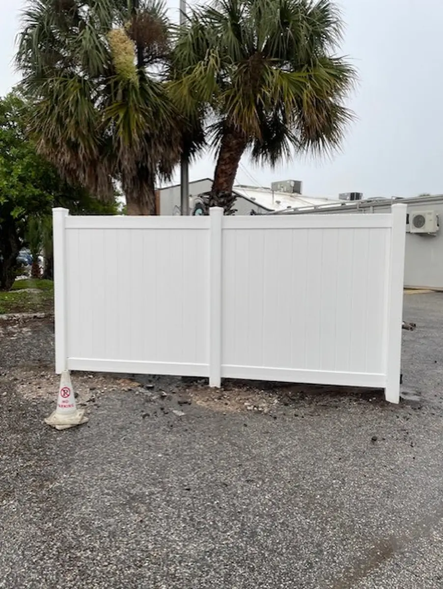 White vinyl dumpster enclosure at an Orlando commercial property